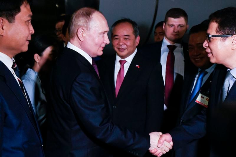 Russian President Vladimir Putin, second left, shakes hands with Vietnamese officials upon his arrival at Noi Bai International Airport in Hanoi, Thursday, June 20, 2024. (Nikita Orlov, Sputnik, Kremlin Pool Photo via AP)