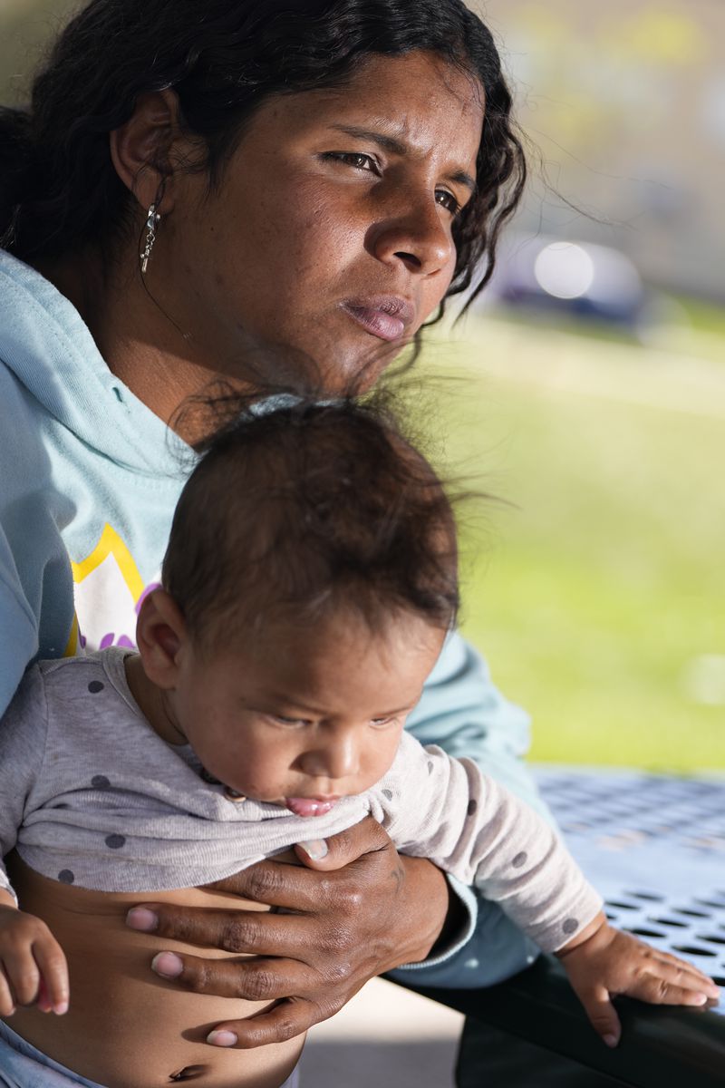 Ivanni Herrera holds her baby Milan Guzman during an interview in a park Friday, May 18, 2024, in Aurora, Colo. (AP Photo/Jack Dempsey)