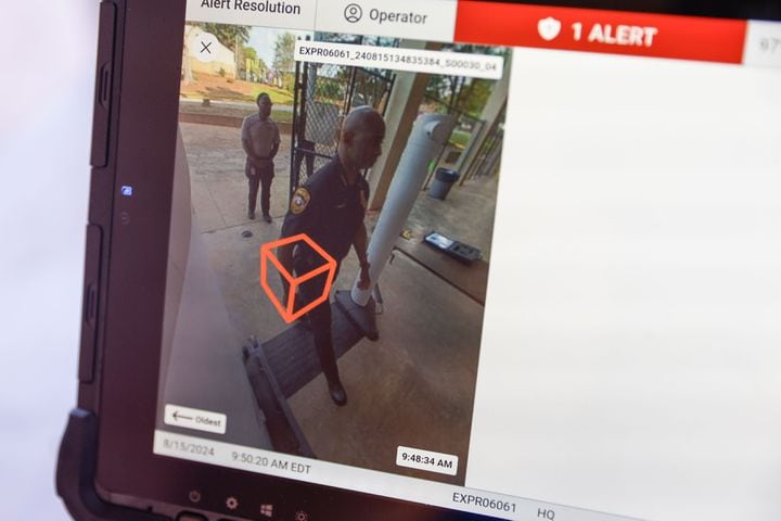 The Evolv weapons detection system detects a weapon during a demonstration at Adams Stadium on Thursday, Aug. 15, 2024. The system has already been implemented in many DeKalb schools and will be expanding to football stadiums. (Natrice Miller/ AJC)