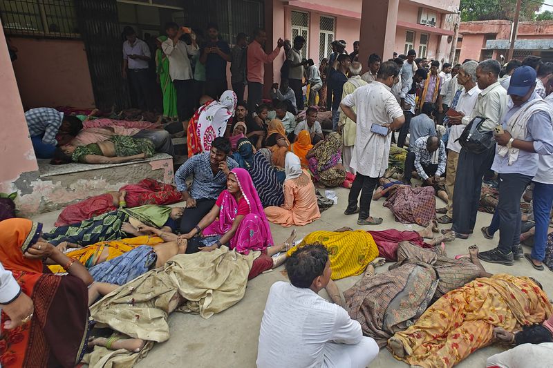 Relatives mourn next to the bodies of their relatives outside the Sikandrarao hospital in Hathras district about 350 kilometers (217 miles) southwest of Lucknow, India, Tuesday, July 2, 2024. A stampede among thousands of people at a religious gathering in northern India has killed at least 105 and left scores injured, officials said Tuesday, with many women and children among the dead. (AP Photo)