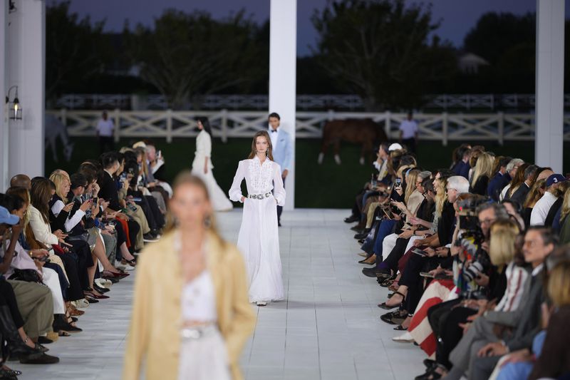 Models walk the runway during the Ralph Lauren Spring/Summer 2025 fashion show as part of New York Fashion Week on Thursday, Sept. 5, 2024, at Khalily Stables in Bridgehampton, N.Y. (Photo by Charles Sykes/Invision/AP)