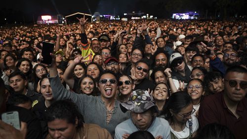 Music fans wait for Mexican singer Danna Paola's performance during the HERA HSBC music festival in Mexico City, Saturday, Aug. 24, 2024. (AP Photo/Aurea Del Rosario)