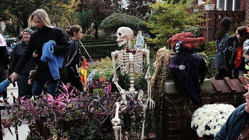 FILE PHOTO:People trick-or-treat in a Brooklyn neighborhood on Halloween night.