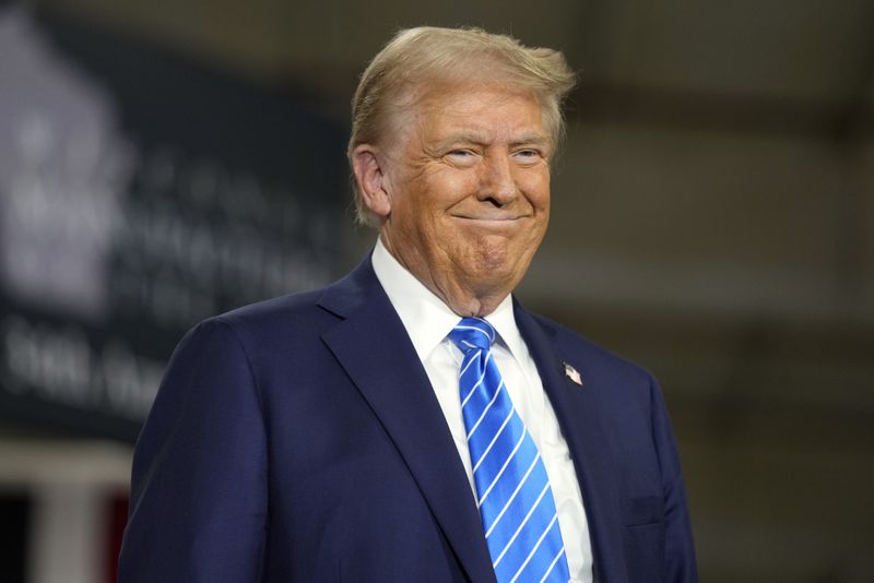 Republican presidential nominee former President Donald Trump arrives at a campaign event at Dane Manufacturing, Tuesday, Oct. 1, 2024, in Waunakee, Wis. (AP Photo/Charlie Neibergall)