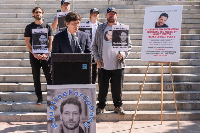 Los Angeles Councilmember Kevin de Leon, surrounded by friends of late actor Johnny Wactor, pictured, speaks during a news conference outside Los Angeles City Hall, in Los Angeles Tuesday, Aug. 13, 2024. asking citizens to help find the suspects that murdered the former "General Hospital" actor. (AP Photo/Damian Dovarganes)