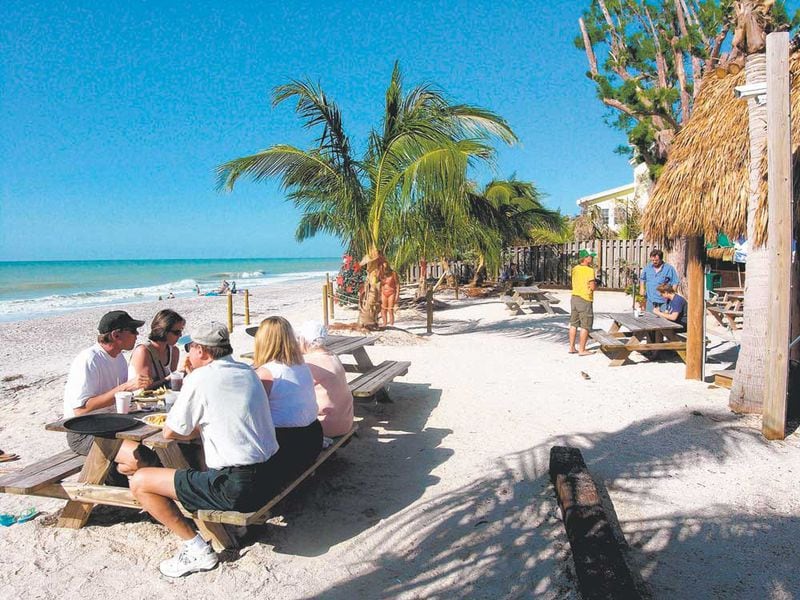 Lunch at the Mucky Duck Pub on Captiva is served with a beach view. The restaurant is near Sanibel Island, a wildlife haven where two-thirds of the island is set aside as a protected preserve.