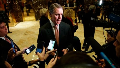 Sen. David Perdue, R-Ga., talks with reporters after meeting with President-elect Donald Trump at Trump Tower, Friday, Dec. 2, 2016, in New York. (AP Photo/Evan Vucci)