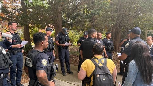 Several Atlanta police officers went door to door Wednesday asking residents if they had any information on the deaths of Dean Phillips and Ned Jackson, who were both shot Oct. 27, 2022.