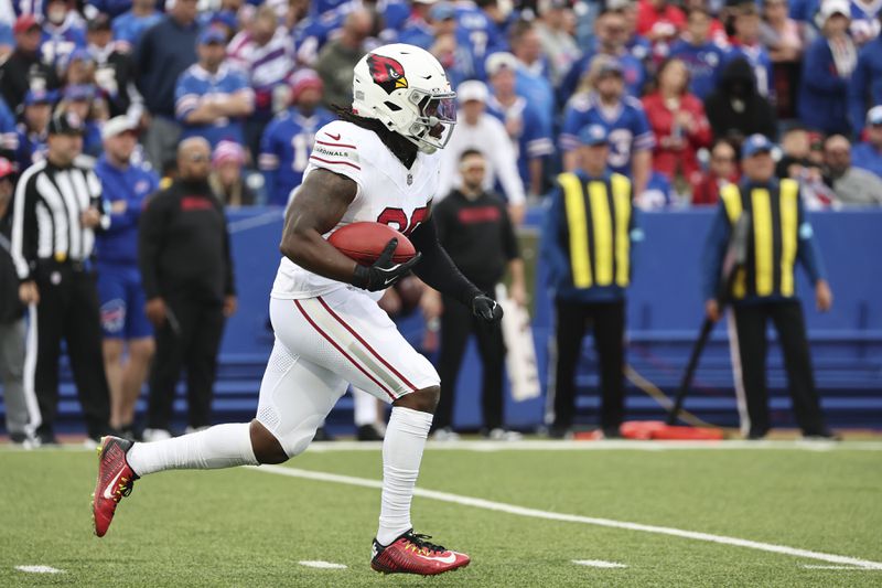 Arizona Cardinals kick returner DeeJay Dallas returns a kickoff for a touchdown against the Buffalo Bills during the second half of an NFL football game Sunday, Sept. 8, 2024, in Orchard Park, N.Y. (AP Photo/Jeffrey T. Barnes)