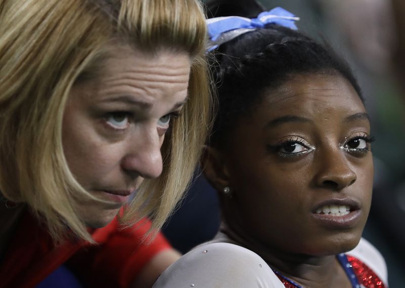 United States' Simone Biles speaks with her coach Aimee Boorman during the artistic gymnastics women's individual all-around final at the 2016 Summer Olympics in Rio de Janeiro, Brazil, Thursday, Aug. 11, 2016. (AP Photo/Dmitri Lovetsky)