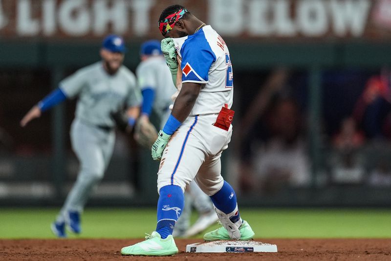 Atlanta Braves outfielder Michael Harris II (23) reacts to being tagged out at second base in the fifth inning of a baseball game against the Toronto Blue Jays, Saturday, Sept. 7, 2024, in Atlanta.(AP Photo/Mike Stewart)