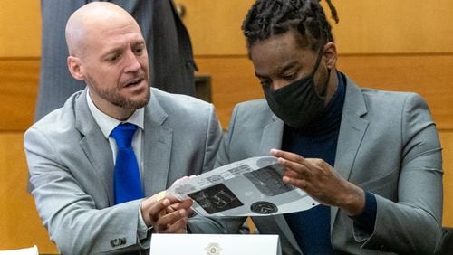 Attorney, Max Schardt, left, talks with his client, Shannon Stillwell, during jury selection in the sweeping Fulton County "Young Slime Life" trial. File photo.  (Steve Schaefer/steve.schaefer@ajc.com)