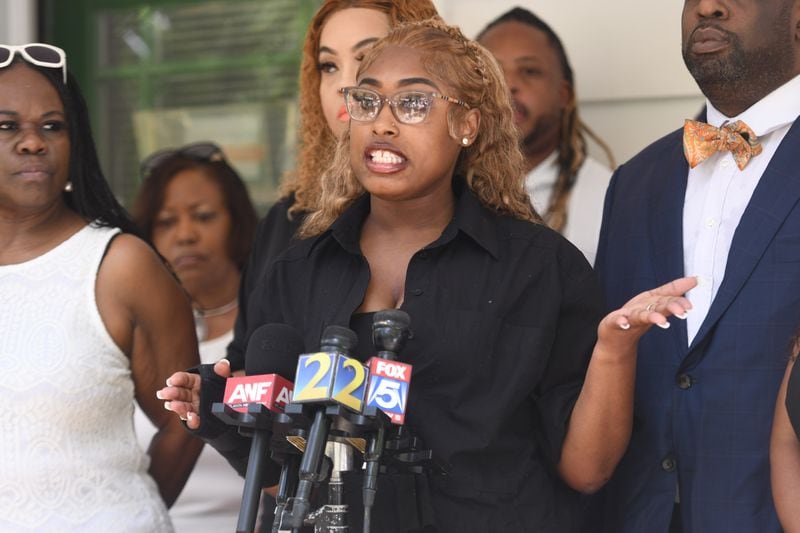 Alexandria Love speaks to reporters Friday about being attacked by a man outside a Buckhead nightclub. She said Douglas County Probate Judge Christina Peterson was the only person who immediately came to her aid. (Photo by Ziyu Julian Zhu/AJC)