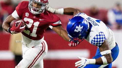 Alabama running back Jase McClellan (21) tries to fend off Kentucky defensive back Kelvin Joseph (1) during a game Saturday, Nov. 21, 2020, in Tuscaloosa, Ala. (Mickey Welsh/The Montgomery Advertiser via AP)