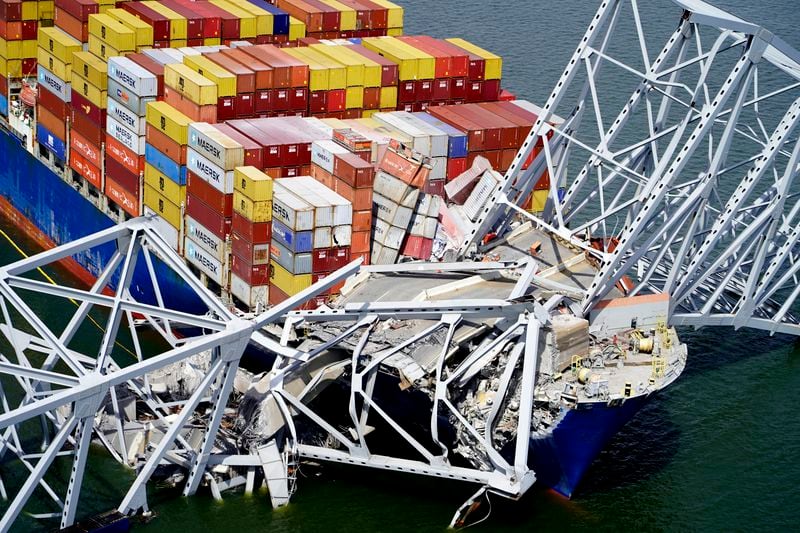 FILE - In this aerial image released by the Maryland National Guard, the cargo ship Dali is stuck under part of the structure of the Francis Scott Key Bridge after the ship hit the bridge, March 26, 2024, in Baltimore. (Maryland National Guard via AP, File)