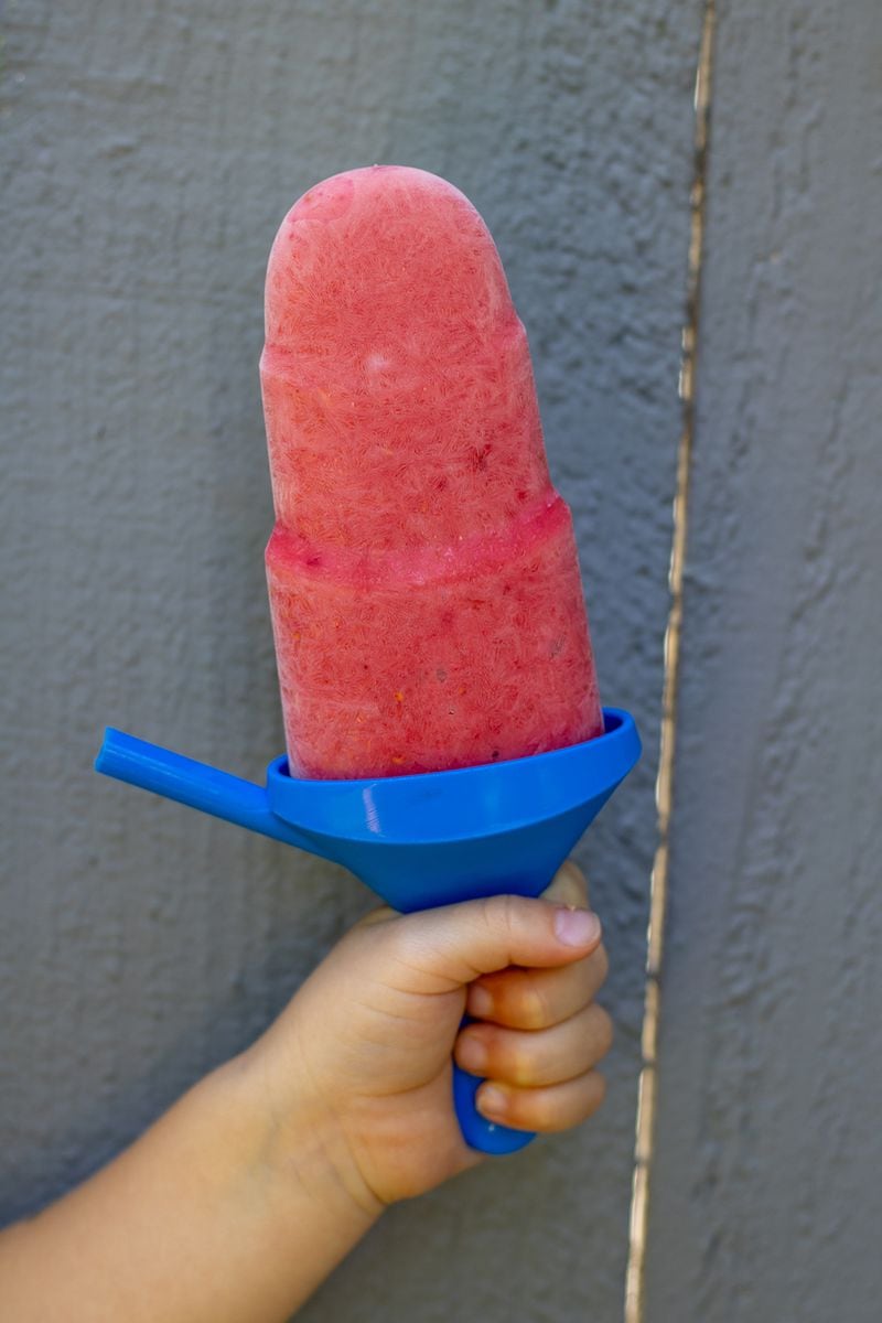 A Raspberry-Mango Smoothie Pop serves as a tasty and filling snack. (Kate Williams for The Atlanta Journal-Constitution)