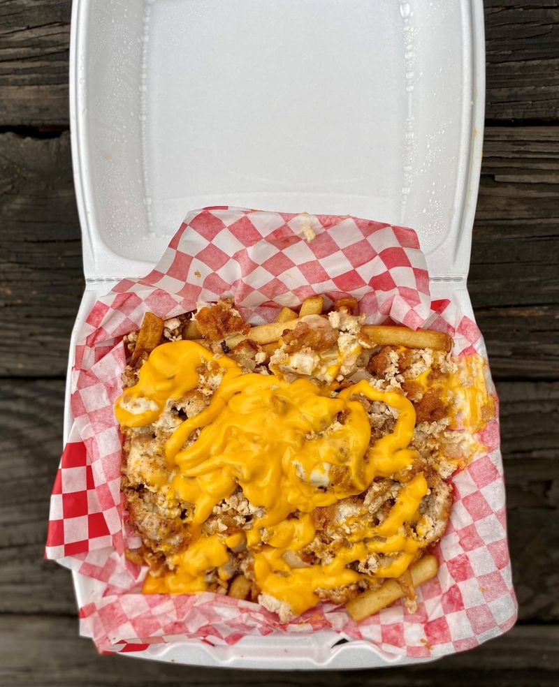 Big Dave’s Cheesesteaks offers loaded fries with cheesesteak fillings. This order of Philly fries is topped with chopped fried chicken and cheese. Wendell Brock for The Atlanta Journal-Constitution