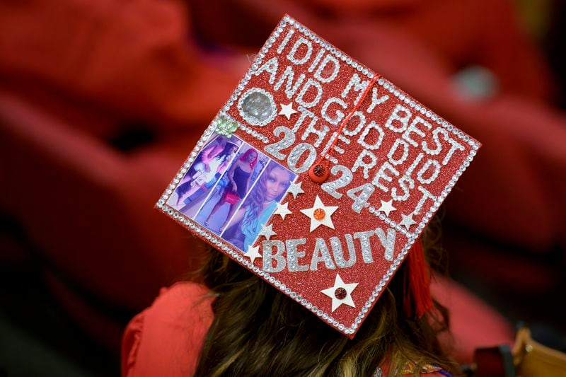 Joshanda Smith decorated her mortarboard graduate cap for a high school equivalency (HiSET) diploma graduation ceremony for the Youth Empowerment Project (YEP) in New Orleans, Thursday, June 27, 2024. (AP Photo/Matthew Hinton)