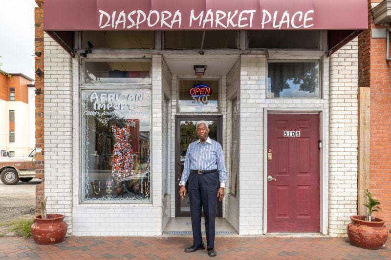 Richard Shinhoster poses for a photo in front of his store, Diaspora Marketplace, on Friday, June 21, 2024 in Savannah, GA. (AJC Photo/Katelyn Myrick)