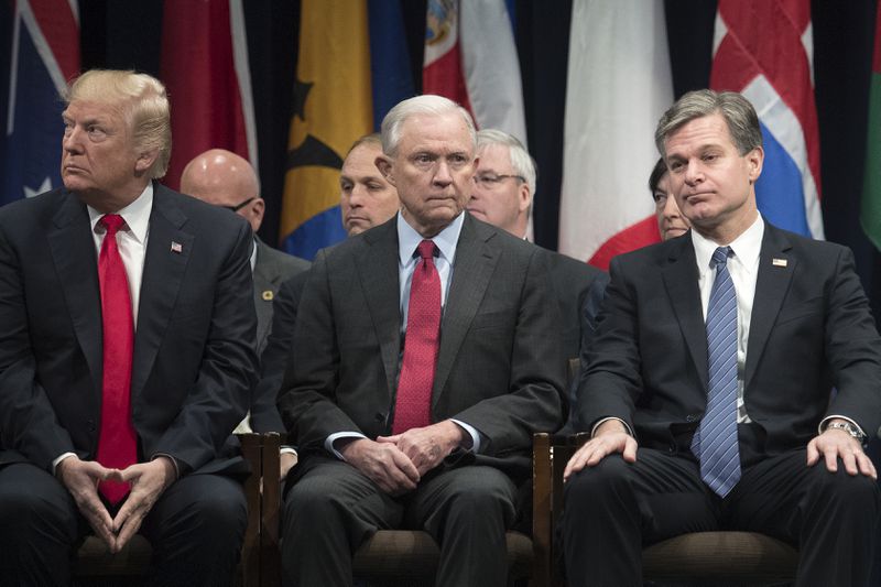 President Donald Trump (from left), Attorney General Jeff Sessions and FBI Director Christopher Wray attend an event at FBI headquarters in Quantico, Va., on Dec. 15, 2017.  Andrew McCabe abruptly stepped down on Jan. 29, 2018, as the FBI's deputy director after months of withering criticism from Trump, telling friends he felt pressure from Wray to leave, according to two people close to Mr. McCabe. (Photo: Tom Brenner/The New York Times)