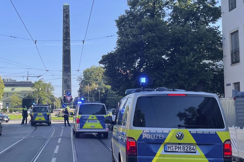 Police vehicles parked in Munich near the Nazi Documentation Center and the Israeli Consulate General in Munich, Germany, Thursday, Sept. 5, 2024. (Simon Sachseder/dpa via AP)