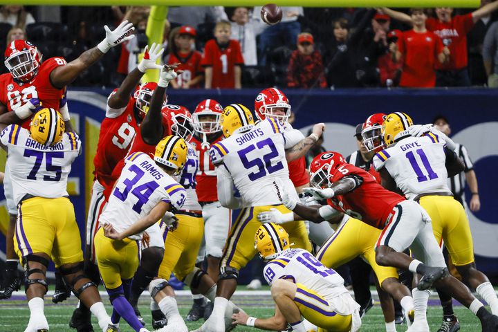 An attempted field goal by LSU Tigers place kicker Damian Ramos (34) is blocked by the Georgia Bulldogs during the first half of the SEC Championship Game at Mercedes-Benz Stadium in Atlanta on Saturday, Dec. 3, 2022. (Bob Andres / Bob Andres for the Atlanta Constitution)