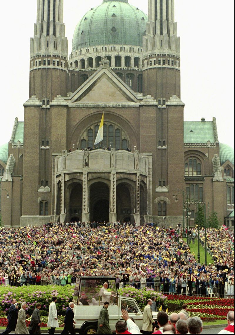 FILE -- Pope John Paul II is cheered as he passes the Basilica of Koekelberg in Brussels Sunday June 4, 1995, during a ceremony to beatify Belgian priest Father Damien De Vuester, who lived and died amongst the lepers of Hawaii during the 19th century. (AP Photo/Massimo Sambucetti, File)