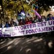 Demonstrators hold a banner reading: Abortion is a fundamental right, as they march in support of the right to abortion for women across the world, in Paris, Saturday, Sept. 28, 2024. (AP Photo/Christophe Ena)