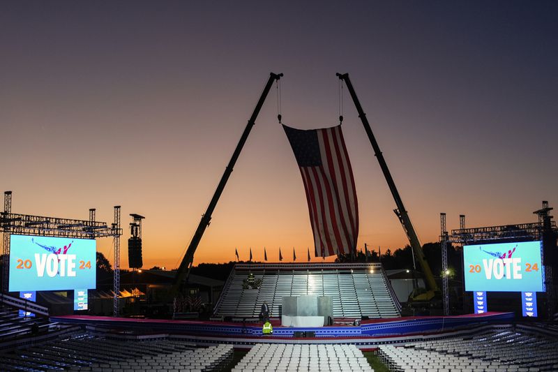 The campaign rally site is seen near sunrise before Republican presidential nominee former President Donald Trump speaks at the Butler Farm Show, Saturday, Oct. 5, 2024, in Butler, Pa. (AP Photo/Julia Demaree Nikhinson)