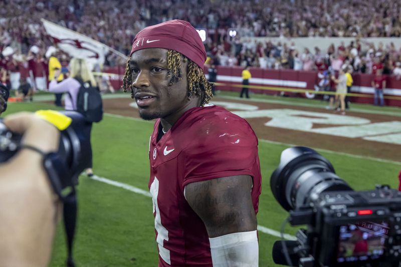 Alabama quarterback Jalen Milroe (4) walks on the field after the team won against Georgia in an NCAA college football game, Saturday, Sept. 28, 2024, in Tuscaloosa, Ala. (AP Photo/Vasha Hunt)