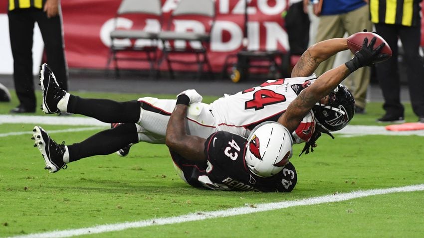 Cardinals beat Falcons 34-33 after Bryant's extra point miss