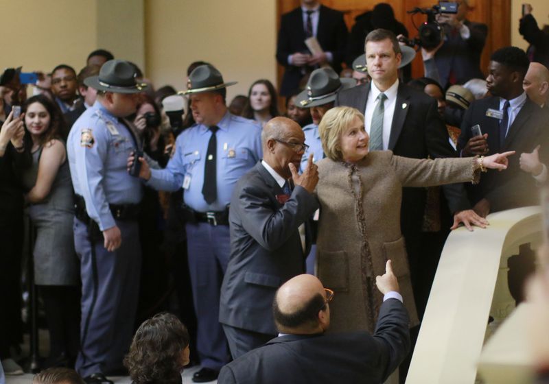 State Rep. Calvin Smyre escorts Hillary Clinton as she departs from an appearance at the Georgia Capitol. Smyre, a Columbus Democrat, served as a co-chair of Bill Clinton's presidential campaigns in Georgia in 1992 and 1996.