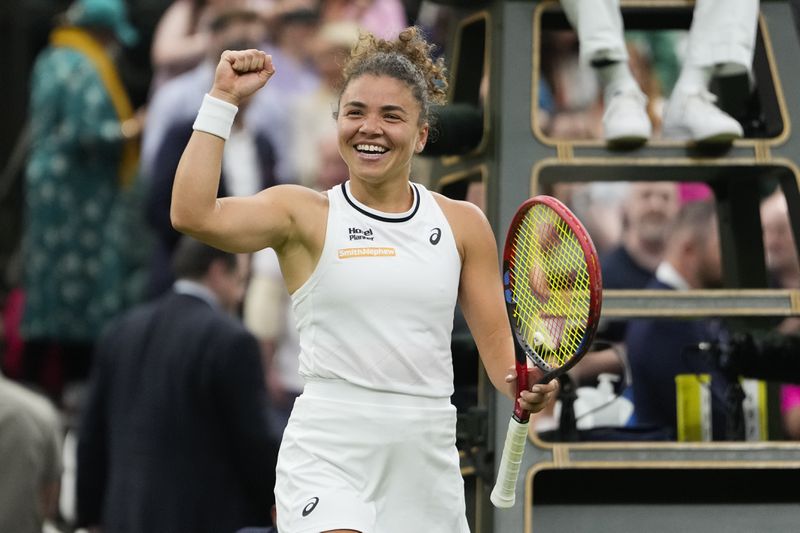 Jasmine Paolini of Italy celebrates after defeating Emma Navarro of the United States in their quarterfinal match at the Wimbledon tennis championships in London, Tuesday, July 9, 2024. (AP Photo/Alberto Pezzali)