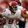 Oklahoma quarterback Michael Hawkins Jr. (9) carries the ball against Auburn during the first half of an NCAA college football game, Saturday, Sept. 28, 2024, in Auburn, Ala. (AP Photo/Butch Dill)