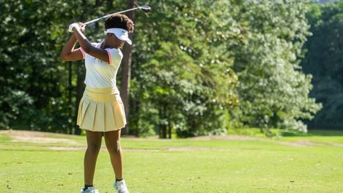 Rhyan McCklsky hits a golf ball during Her Shot golf program at Stone Mountain Golf Club in Stone Mountain on Monday, July 22, 2024.  (Ziyu Julian Zhu / AJC)