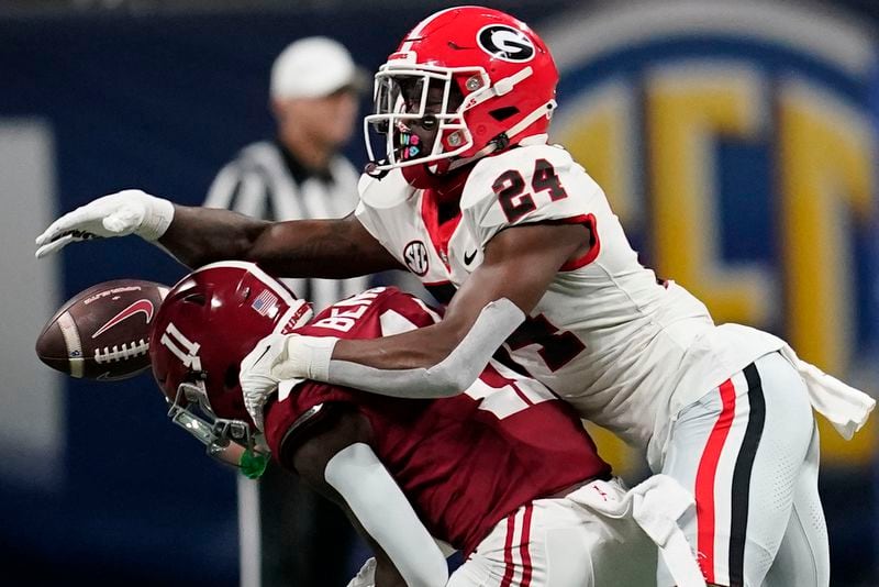 FILE - Alabama wide receiver Malik Benson (11) misses a pass against Georgia defensive back Malaki Starks (24) during the first half of the Southeastern Conference championship NCAA college football game in Atlanta, Saturday, Dec. 2, 2023. (AP Photo/Mike Stewart, File)