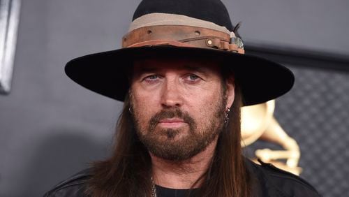 FILE - Billy Ray Cyrus arrives at the 62nd annual Grammy Awards in Los Angeles on Jan. 26, 2020. Cyrus and Firerose are now divorced. The dissolution of their seven-month marriage was finalized Monday by a Williamson County judge in Tennessee three months after Cyrus filed for divorce. (Photo by Jordan Strauss/Invision/AP, File)