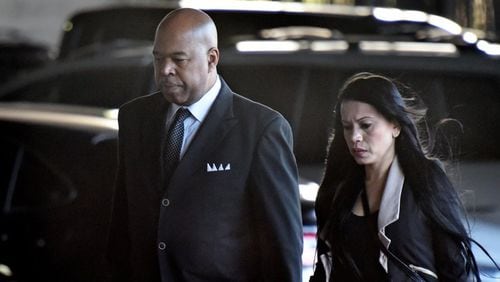 Larry Scott, left, a former top Atlanta contracting official, walks into the Richard B. Russell Federal Building for his sentencing on Tuesday, Jan. 7, 2020. Scott was sentenced to two years in prison after admitting last year to being paid on the sly more than $220,000 over five years to help companies win government contracts, including with the city. HYOSUB SHIN / HYOSUB.SHIN@AJC.COM