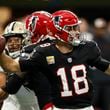 Atlanta Falcons quarterback Kirk Cousins (18) works against the New Orleans Saints during the first half of an NFL football game, Sunday, Sept. 29, 2024, in Atlanta. (AP Photo/Butch Dill)