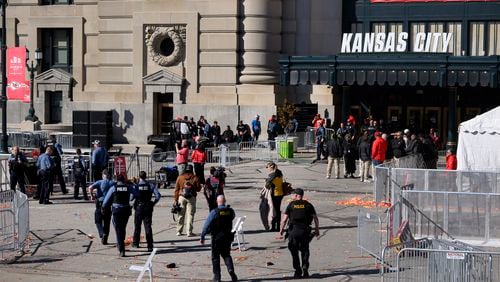 FILE - Law enforcement personnel approach Union Station following a shooting at the Kansas City Chiefs NFL football Super Bowl celebration in Kansas City, Mo., Wednesday, Feb. 14, 2024. (AP Photo/Reed Hoffmann, File)