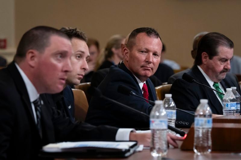 From left, Sgt. Edward Lenz, Commander of Butler County Emergency Services Unit, Patrolman Drew Blasko of Butler Township Police Department, Lt. John Herold of Pennsylvania State Police, and former U.S. Secret Service agent Patrick Sullivan, testify at the first public hearing of a bipartisan congressional task force investigating the assassination attempts against Republican presidential nominee former President Donald Trump, on Capitol Hill in Washington, Thursday, Sept. 26, 2024. (AP Photo/Ben Curtis)