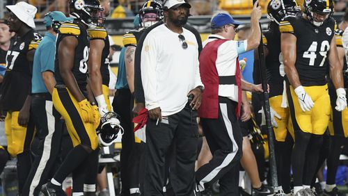 Pittsburgh Steelers head coach Mike Tomlin, center, watches from the sidelines in the second half of a preseason NFL football game against the Houston Texans, Friday, Aug. 9, 2024, in Pittsburgh. (AP Photo/Matt Freed)