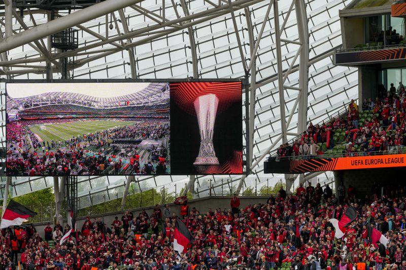 Leverkusen fans wave flags before the Europa League final soccer match between Atalanta and Bayer Leverkusen at the Aviva Stadium in Dublin, Ireland, Wednesday, May 22, 2024. (AP Photo/Kirsty Wigglesworth)