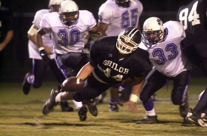 Shiloh's David Pollack looks to lateral the football during a two-point attempt in a game against Duluth. (KENT D. JOHNSON/AJC file photo)