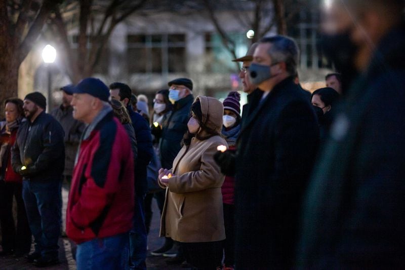 Dozens attended the vigil Thursday night at the Marietta Square.