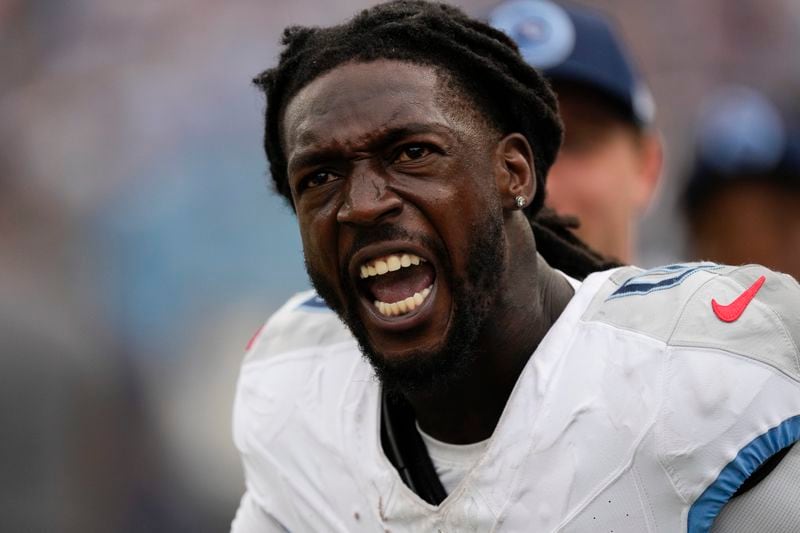 Tennessee Titans wide receiver Calvin Ridley (0) celebrates after scoring a touchdown in the second half of an NFL football game against the New York Jets in Nashville, Tenn., on Sunday, Sept. 15, 2024. (AP Photo/George Walker IV)