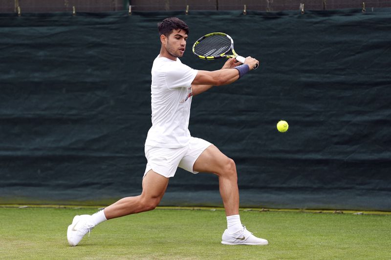 Spain's Carlos Alcaraz practises at the All England Lawn Tennis and Croquet Club in Wimbledon, ahead of the Wimbledon Championships, which begin on July 1st, in London, Thursday June 27, 2024. (Zac Goodwin/PA via AP)