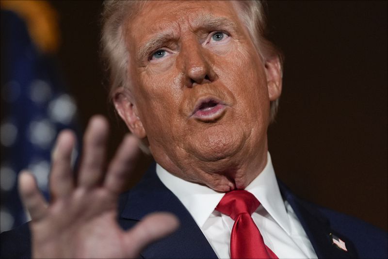 Republican presidential nominee former President Donald Trump talks with reporters at a campaign event at ll Toro E La Capra, Friday, Aug. 23, 2024, in Las Vegas. (AP Photo/Julia Nikhinson)