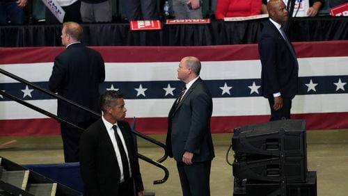 Members of the U.S. Secret Service look on as Republican presidential candidate former President Donald Trump speaks at a campaign event with Republican vice presidential candidate Sen. JD Vance, R-Ohio, Saturday, July 20, 2024, at Van Andel Arena in Grand Rapids, Mich. (AP Photo/Carlos Osorio)