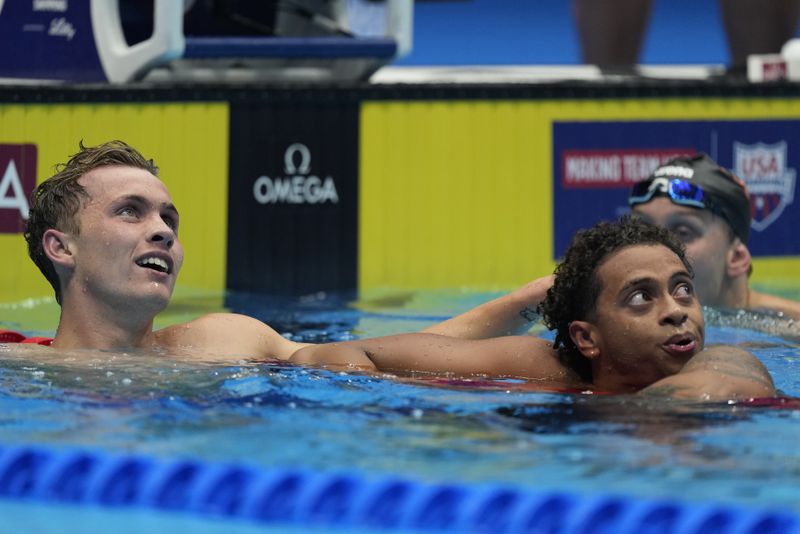 Shaine Casas and Carson Foster celebrate after the Men's 200 individual medley finals Friday, June 21, 2024, at the US Swimming Olympic Trials in Indianapolis. (AP Photo/Michael Conroy)